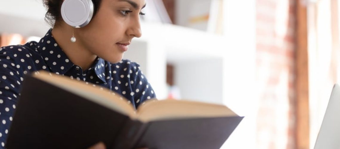 Indian woman prepare essay using textbook and internet online website, translator make translation using professional literature, self-education, teacher individual grow and improve knowledge concept