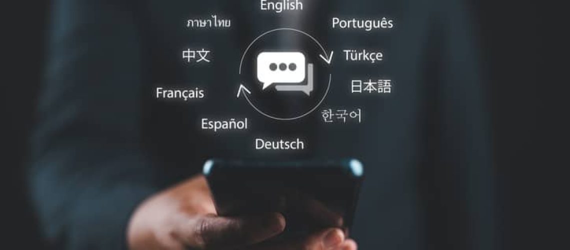 Translator app and languages education concept. Person use mobile smartphone with with translator app to translation of foreign languages. language course and e-learning.